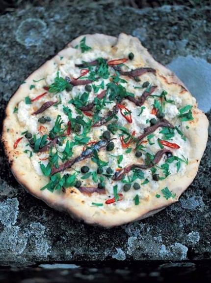 Pizza dough and anchovies
