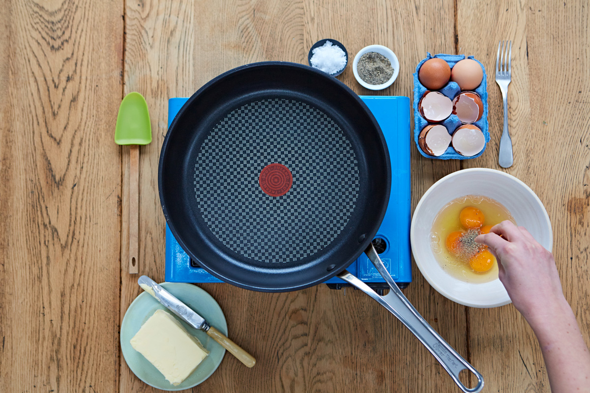 Image of salt and pepper being added to the eggs
