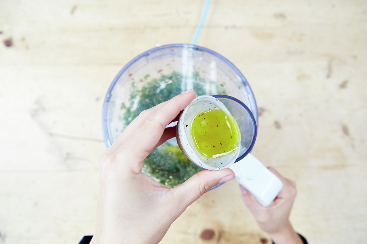 Image of olive oil being added to belnder
