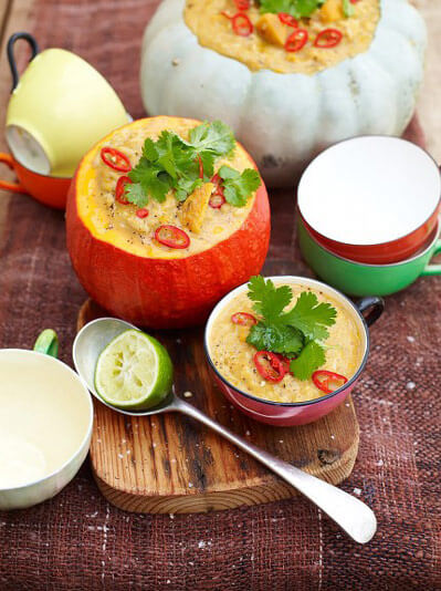 bowl of soup on a chopping board