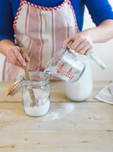 Image of sourdough starter flour and water being combined